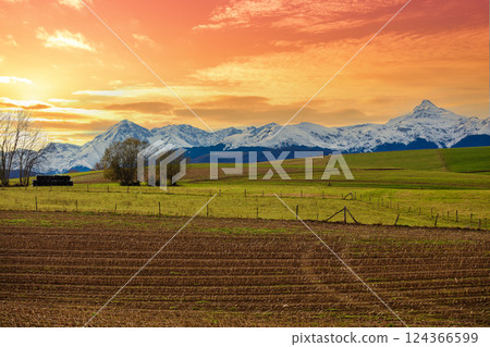 Mountains landscape in autumn. View of arable fields in the valley and mountain ridge covered with snow during sunset, Pyrenees, Andorra, Europe Mountains landscape in autumn. View of arable fields in the valley and mountain ridge covered with snow during sunset, Pyrenees, Andorra, Europe 124366599