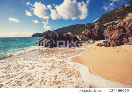 Rocky seascape on a sunny day, view of sunny bay. Galapinhos beach, Setubal, Portugal 124366619