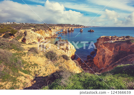 Coastal rocky seascape, view of Praia da Marinha beach in Algarve region in Atlantic ocean, Portugal, Europe Coastal rocky seascape, view of Praia da Marinha beach in Algarve region in Atlantic ocean, Portugal, Europe 124366639