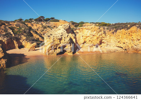 Coastal rocky seascape, view of Praia da Marinha beach in Algarve region in Atlantic ocean, Portugal, Europe 124366641