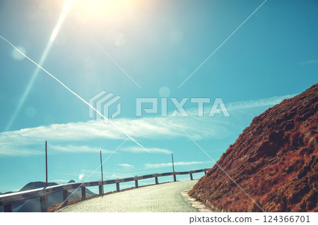 Winding mountain road and day sky. Sharp turn. Grossglockner High Alpine Road. Austria, Europe 124366701