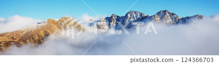 Mountains minimalist landscape. Peaks of the mountains above the clouds. Pyrenees, Andorra, Europe. Horizontal banner 124366703