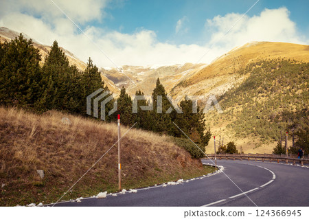 Sharp turn. Driving on a winding mountain road in the Pyrenees, Andorra, Europe. 124366945