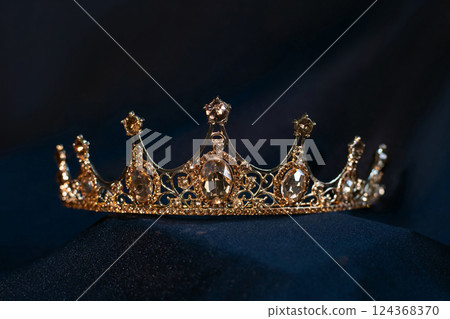 Luxury golden crown with citrine gemstones and diamonds 124368370