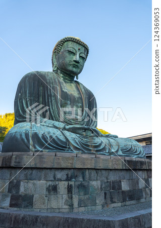KAMAKURA, JAPAN - Nov 8, 2024: People traveling at Great Buddha of Kamakura KAMAKURA, JAPAN - Nov 8, 2024: People traveling at Great Buddha of Kamakura 124369053
