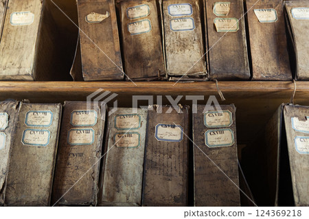 Contents of a cabinet of very old archives 124369218