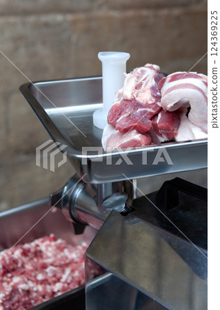 Meat and mincer in a butcher shop 124369225