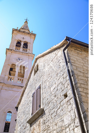 Fortified Church of St. Mary in Jelsa old town on the Adriatic island of Hvar in the county of Split-Dalmatia in Croatia 124370686