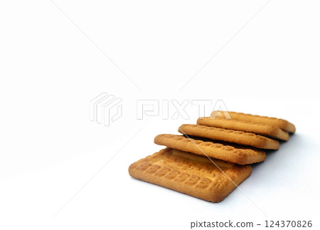 Indian biscuits stacked over white background 124370826