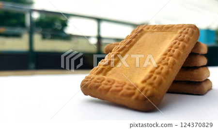 Indian biscuits stacked over white background 124370829