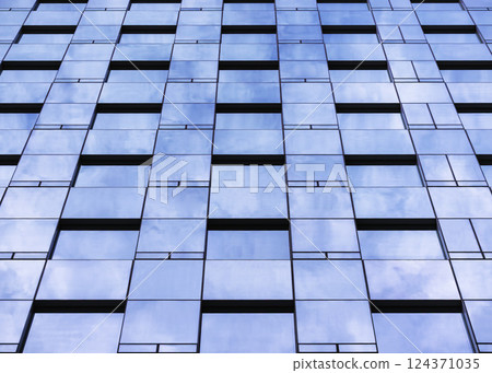 Glass wall Modern building facade Sky reflection perspective Architecture details Glass wall Modern building facade Sky reflection perspective Architecture details 124371035