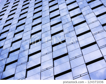 Glass wall Modern building facade Sky reflection perspective Architecture details Glass wall Modern building facade Sky reflection perspective Architecture details 124371036