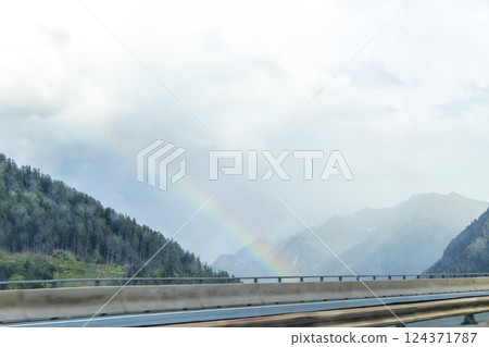 Mountain landscape mountains green fields forest and rainbow Tyrol Austria. 124371787