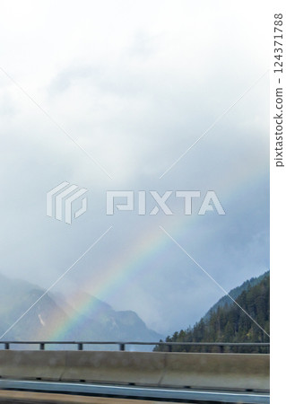 Mountain landscape mountains green fields forest and rainbow Tyrol Austria. 124371788