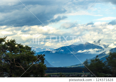 Mountain landscape mountains green fields forest clouds in Vorarlberg Austria. Mountain landscape mountains green fields forest clouds in Vorarlberg Austria. 124371828