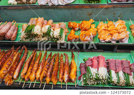assortment of traditional Vietnamese street food on counter at the Asian Night Market in Vietnam in Asia in Da Nang assortment of traditional Vietnamese street food on counter at the Asian Night Market in Vietnam in Asia in Da Nang 124373072