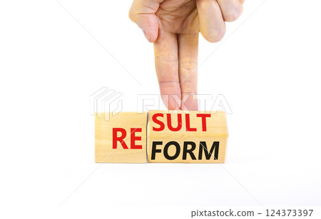 Reform and result symbol. Concept words Reform Result on beautiful wooden block. Beautiful white table white background. Businessman hand. Business Reform and result concept. Copy space. Reform and result symbol. Concept words Reform Result on beautiful wooden block. Beautiful white table white background. Businessman hand. Business Reform and result concept. Copy space. 124373397