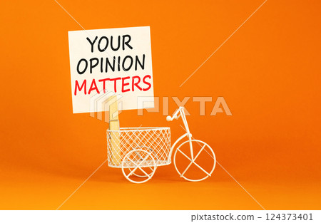 Your opinion matters symbol. Concept words Your opinion matters on beautiful white paper on clothespin. Beautiful orange background. Miniature bicycle. Business your opinion matters concept Copy space Your opinion matters symbol. Concept words Your opinion matters on beautiful white paper on clothespin. Beautiful orange background. Miniature bicycle. Business your opinion matters concept Copy space 124373401