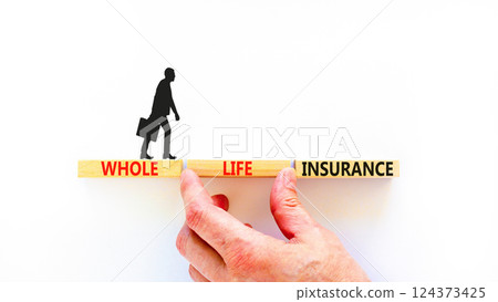 Whole life insurance symbol. Concept words Whole life insurance on beautiful wooden blocks. Beautiful white background. Businessman hand. Business whole life insurance concept. Copy space. Whole life insurance symbol. Concept words Whole life insurance on beautiful wooden blocks. Beautiful white background. Businessman hand. Business whole life insurance concept. Copy space. 124373425