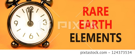 Rare earth elements symbol. Concept words Rare earth elements on beautiful orange paper. Alarm clock. Beautiful orange paper background. Business and rare earth elements concept. Copy space. 124373534