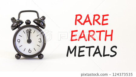Rare earth metals symbol. Concept words Rare earth metals on beautiful white paper. Alarm clock. Beautiful white paper background. Business and rare earth metals concept. Copy space. Rare earth metals symbol. Concept words Rare earth metals on beautiful white paper. Alarm clock. Beautiful white paper background. Business and rare earth metals concept. Copy space. 124373535