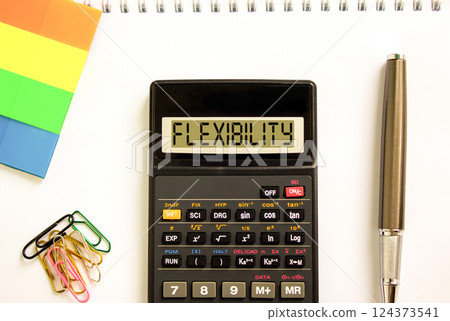 Flexibility symbol. Concept word Flexibility on beautiful black calculator. Beautiful white paper background. Beautiful black pen. Colored paper. Business flexibility concept. Copy space. 124373541