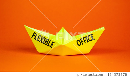 Flexible office symbol. Concept words Flexible office on beautiful yellow paper boat. Beautiful orange paper background. Business Flexible office concept. Copy space. Flexible office symbol. Concept words Flexible office on beautiful yellow paper boat. Beautiful orange paper background. Business Flexible office concept. Copy space. 124373576