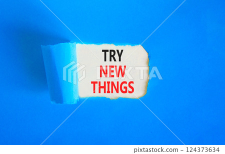 Try new things symbol. Concept words Try new things on beautiful white paper. Beautiful blue paper background. Business motivational lifestyle try new things concept. Copy space. Try new things symbol. Concept words Try new things on beautiful white paper. Beautiful blue paper background. Business motivational lifestyle try new things concept. Copy space. 124373634
