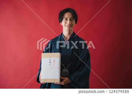 Celebration gift - Man delivering gratitude 124374589