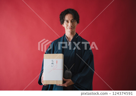 Celebration gift - Man delivering gratitude Celebration gift - Man delivering gratitude 124374591