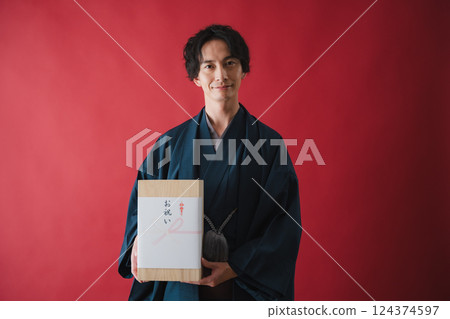 Celebration gift - Man delivering gratitude 124374597