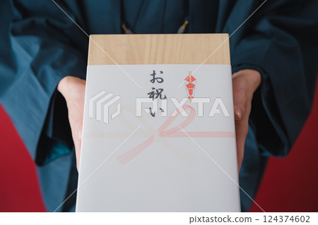 Celebration gift - Man delivering gratitude Celebration gift - Man delivering gratitude 124374602