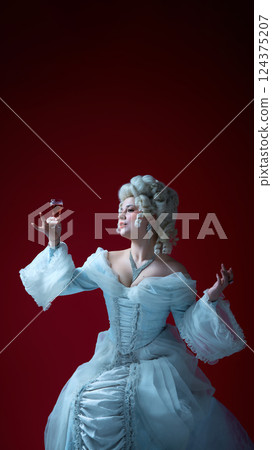 Royal indulgence. Portrait of woman holding wineglass in confident pose, showcasing elegance and ritual of aristocracy. Royal indulgence. Portrait of woman holding wineglass in confident pose, showcasing elegance and ritual of aristocracy. 124375207