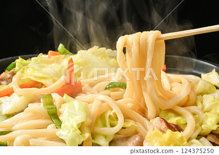 Fried udon noodles being cooked 124375250