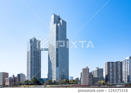 Skyscrapers in the blue sky Skyscrapers in the blue sky 124375316