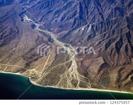 cabo pulmo baja california sur coast and mountains of sierra Guadalupe aerial view from airplane cabo pulmo baja california sur coast and mountains of sierra Guadalupe aerial view from airplane 124375857