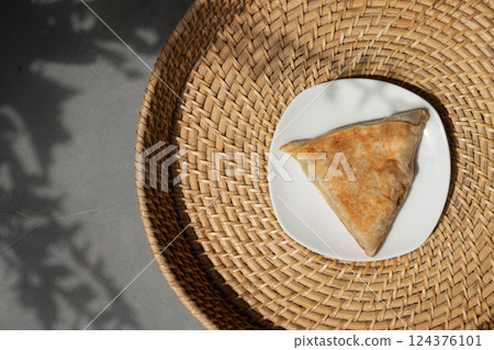 Vegetable roti in plate. Typical type of evening snack or breakfast in Sri Lanka. Asian cuisine. Sri Lankan street food. View from above. Copy space 124376101