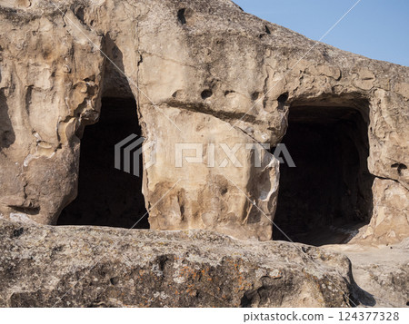 Uplistsikhe, Georgia, Unique rock formations reveal ancient caves under clear skies 124377328