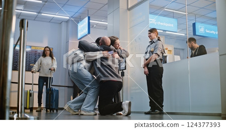 Airport Terminal: Happy Man Greeting His Family Back From Vacation Trip Airport Terminal: Happy Man Greeting His Family Back From Vacation Trip 124377393