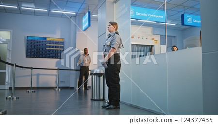 Female TSA Officer Checking Woman with Physical Disability in Airport Terminal Female TSA Officer Checking Woman with Physical Disability in Airport Terminal 124377435