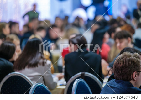 Blurred view of a diverse gathering at a professional networking event Blurred view of a diverse gathering at a professional networking event 124377648