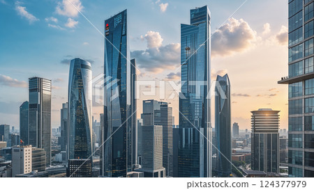 Modern metropolis shines at sunset, glass skyscrapers reaching for the clouds 124377979