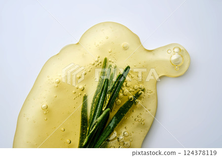A drop of rosemary cosmetic product. A drop of rosemary cosmetic product. 124378119