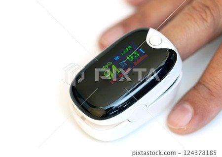 A pulse oximeter, displaying vital health metrics against a light backdrop 124378185