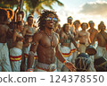 Barechested man dances happily in front of crowd, tribal chief vibes 124378550