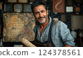 Man with beard and moustache in apron holds paper, smiles 124378561