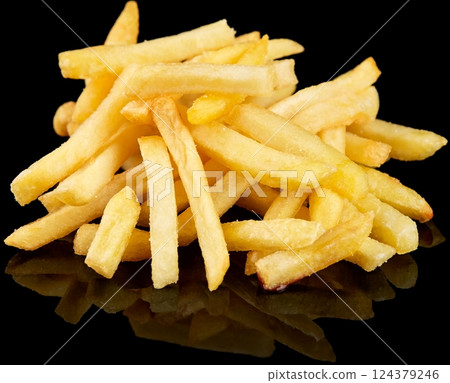 Golden Crispy French Fries on reflective Black Background Golden Crispy French Fries on reflective Black Background 124379246