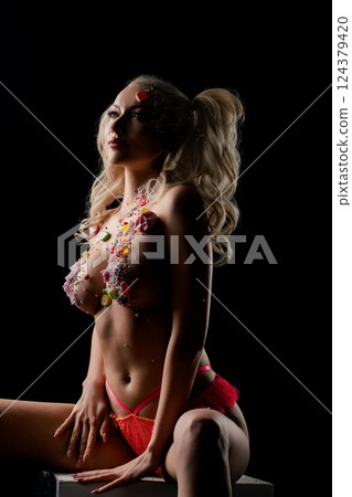 Beauty in body art with intricate designs and vibrant colors at night 124379420