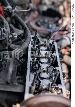 Cylinder head of an auto engine. Oil removal valve. Car repair. Car service 124379507