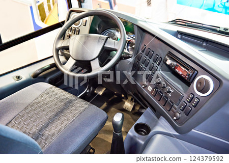 Driver seat and steering wheel with dashboard of bus Driver seat and steering wheel with dashboard of bus 124379592
